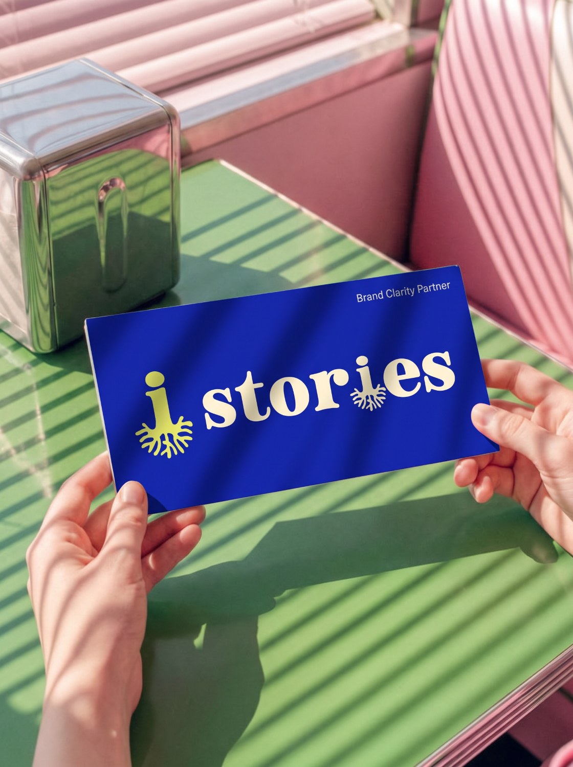 Stories business card in hand