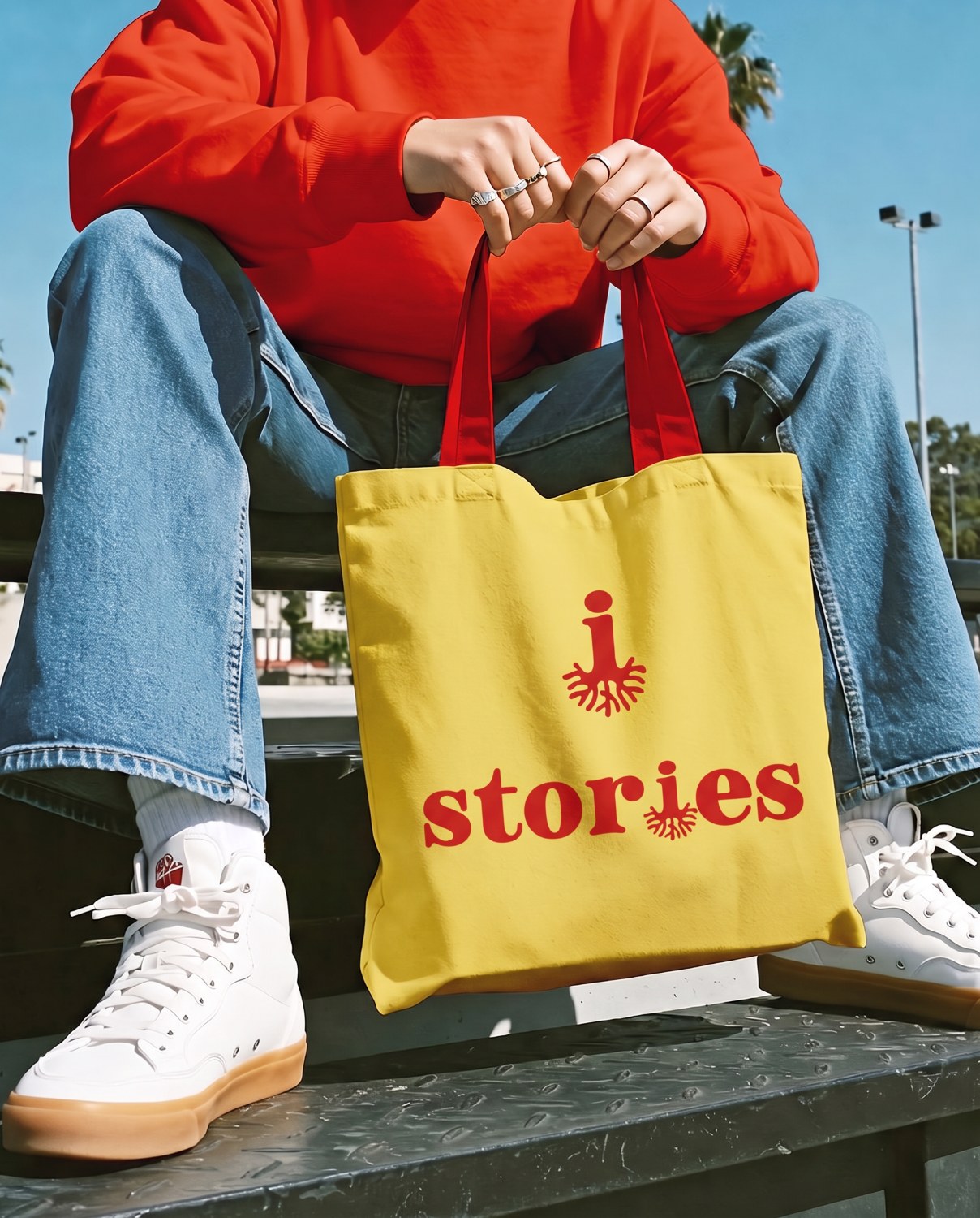 Stories branded yellow tote bag
